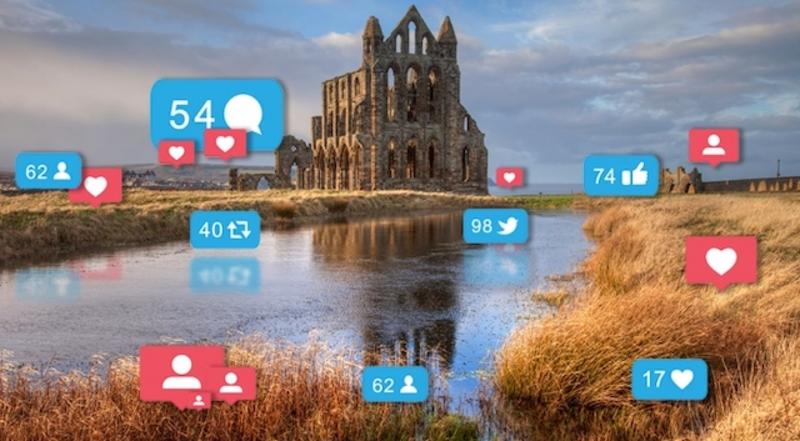 whitby abbey with social media icons 670x370