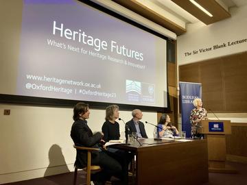 Ouhn panel event A panel sitting in front of a Heritage Futures presentation