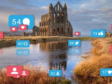 whitby abbey with social media icons 670x370