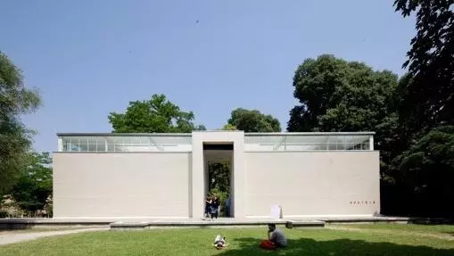 white rectangular building with trees