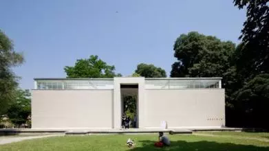 white rectangular building with trees
